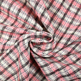 Tweed de polyester à carreaux noir et rose fond crème