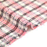 Tweed de polyester à carreaux noir et rose fond crème