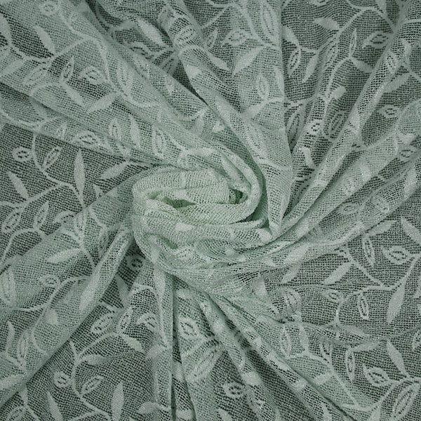 Maille dentelle ajourée motif végétal fond vert d'eau