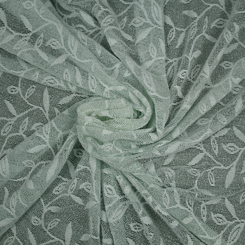 Maille dentelle ajourée motif végétal fond vert d'eau