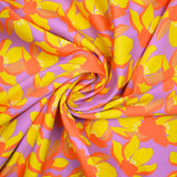 Satin de coton élasthanne fleurs orange fond violet