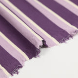 Maille Milano rayure mauve et écrue fond violet