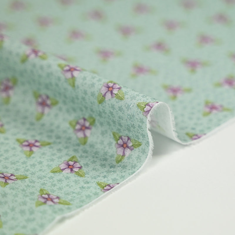 Coton imprimé mini fleurs violette fond vert