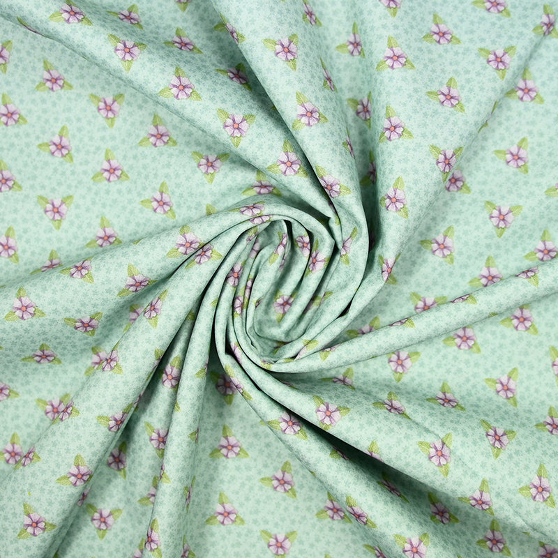 Coton imprimé mini fleurs violette fond vert