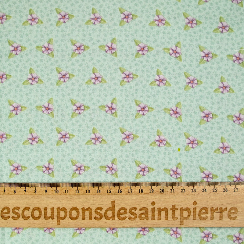 Coton imprimé mini fleurs violette fond vert