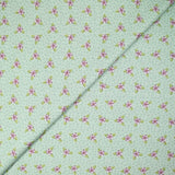 Coton imprimé mini fleurs violette fond vert