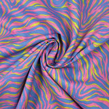 Coton imprimé zèbre jaune et bleu fond rose