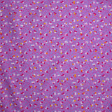 Coton imprimé fleurs de Sandra fond violet