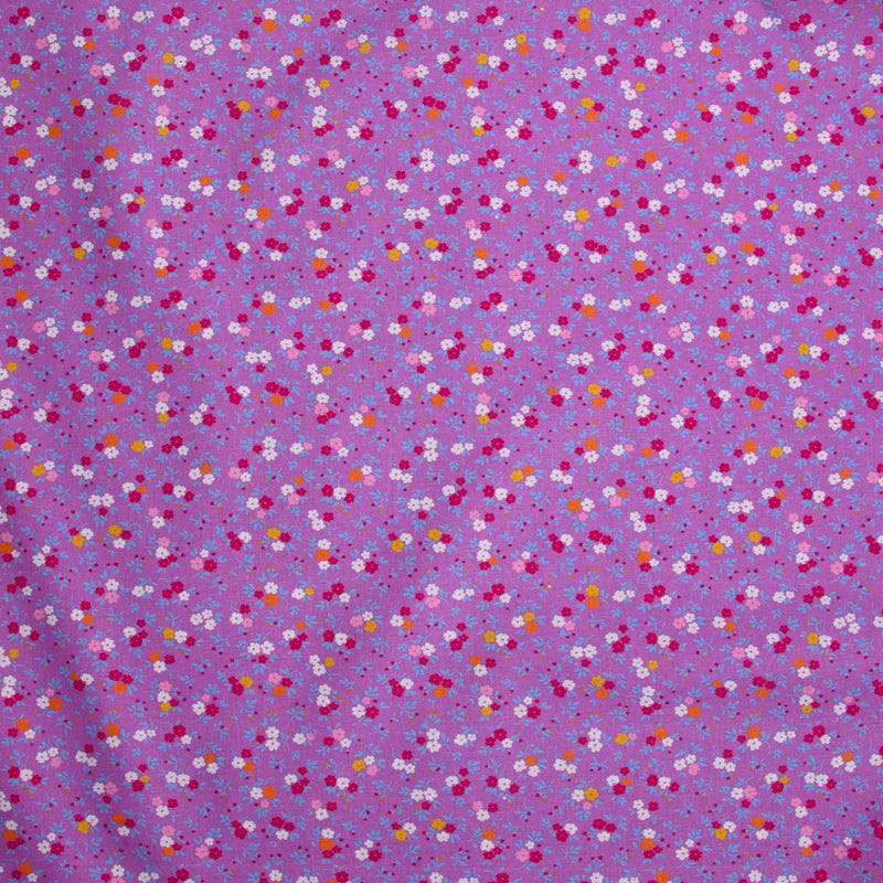 Coton imprimé fleurs de Sandra fond violet