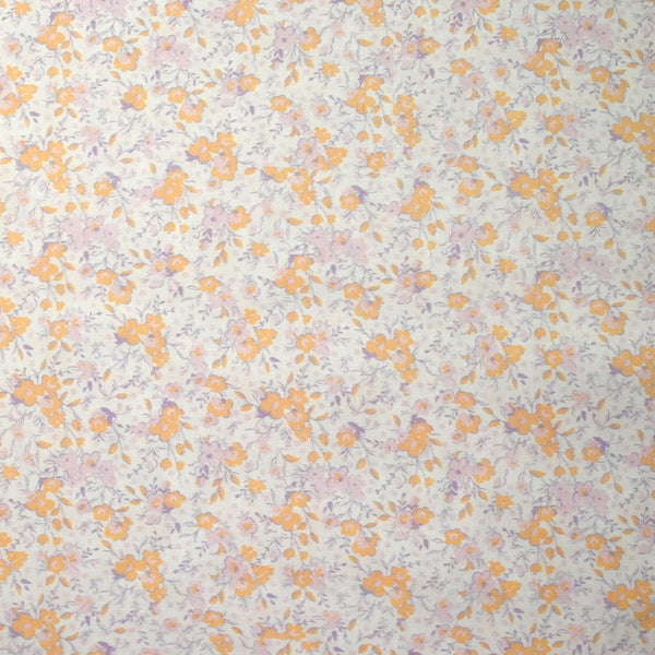 Coton imprimé fleurs du printemps pêche et parme fond blanc
