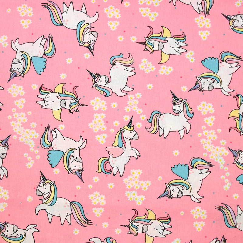 Coton imprimé licorne magique fond rose