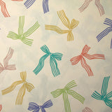 Coton imprimé nœuds en ruban fond écru