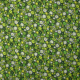 Coton imprimé prairie en fleurs anis fond vert foncé
