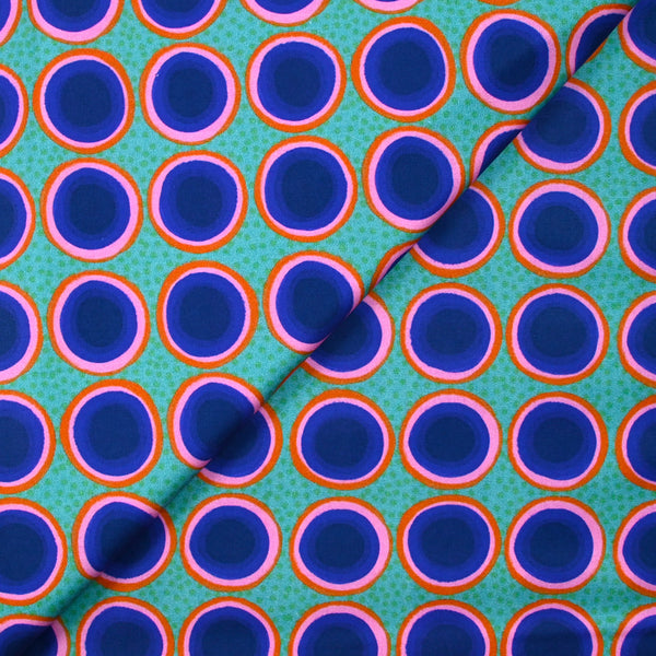 Coton imprimé rond rose, orange et bleu fond vert