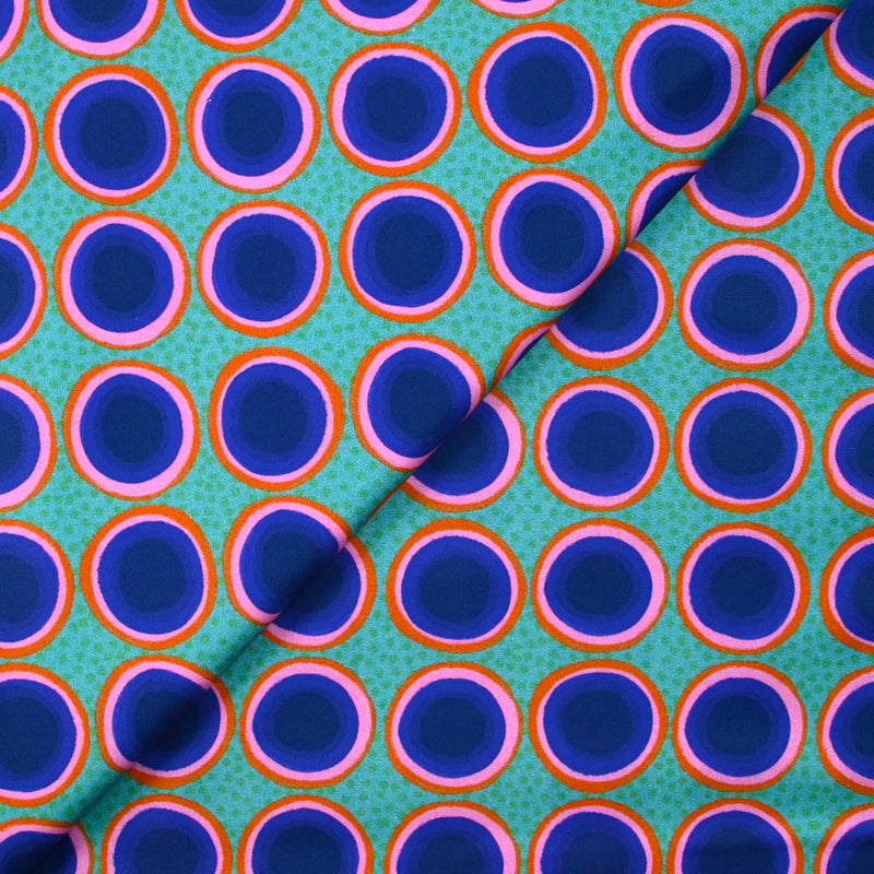 Coton imprimé rond rose, orange et bleu fond vert