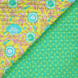 Coton matelassé double face ethnique et fleurs vert anis au mètre
