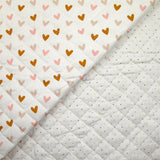 Coton matelassé double face Aurora pois et cœurs fond blanc au mètre