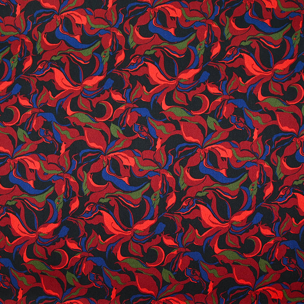 Crêpe satiné de polyester Amaryllis rouge et bleu marine fond noir
