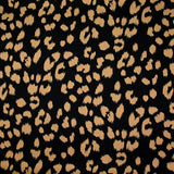 Crêpe satiné de polyester sauvage mordoré fond noir