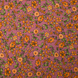 Crêpe viscose imprimé fleurs orange fond cassis glacé