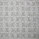 Dentelle polyester géométrie de fleurs fond blanc