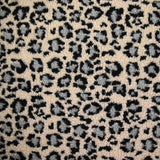 Fausse fourrure léopard gris fond beige