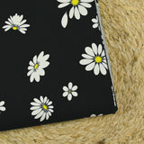 Gabardine de coton imprimée marguerite fond noir
