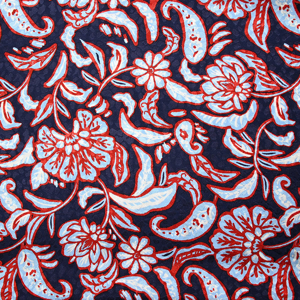 Jacquard de viscose satinée imprimée fleurs rouge et bleu ciel fond bleu