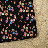 Jersey de viscose imprimé fleur psychédélique fond noir
