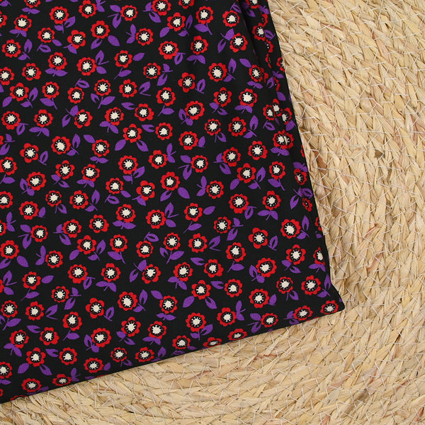 Jersey de viscose imprimé fleurs rouge et violette fond noir
