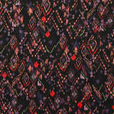 Maille crêpe imprimée ethnique fond noir