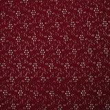 Maille polyester ajourée fleurs fond bordeaux
