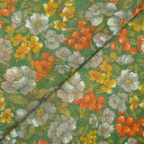 Maille polyester lamé fleurs orange et vert fond vert prairie