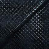 Matelassé imprimé reptile fond bleu marine