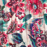 Mousseline imprimée bande satin carnaval de fleurs fond nacre