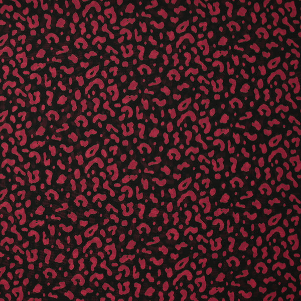 Mousseline imprimée léopard framboise fond noir