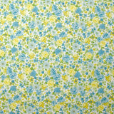 Piqué de coton imprimé les fleurs de Sarah bleu et jaune fond blanc