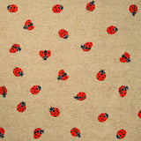 Polycoton imprimé coccinelle fond ficelle