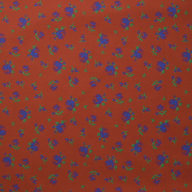 Polyviscose imprimée fleurs bleues fond brique