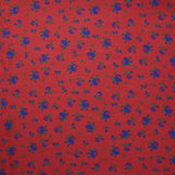 Polyviscose imprimée fleurs bleues fond rouge