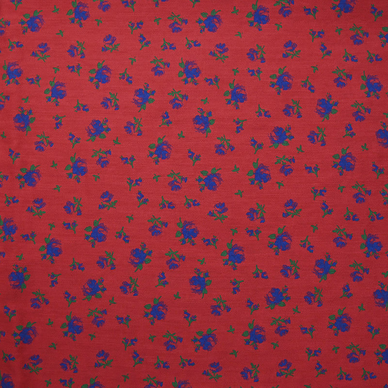 Polyviscose imprimée fleurs bleues fond rouge