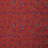 Polyviscose imprimée vent de fleurs fond rouge
