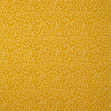 Popeline de coton imprimée feuillage fond jaune
