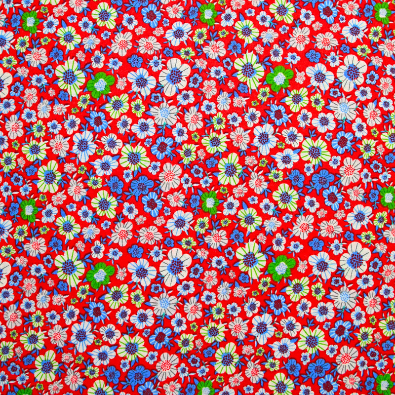 Popeline de coton imprimée fleurs Alba vert et bleu fond rouge