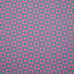 Coated poplin printed fields of green flowers with pink background