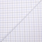 Popeline polycoton tissée-teinte à carreaux pointillé noir et bleu fond blanc