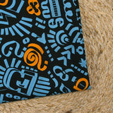 Satin de coton léger imprimé graffitis bleu et orange fond noir