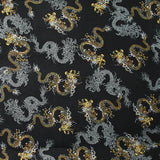 Satin de polyester mat imprimé serpent jaune et gris fond noir