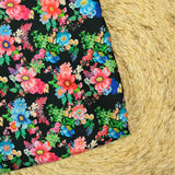 Satin polyester imprimé champs de fleurs fond noir