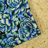 Satin polyester imprimé fleur jaune, verte et bleue fond noir
